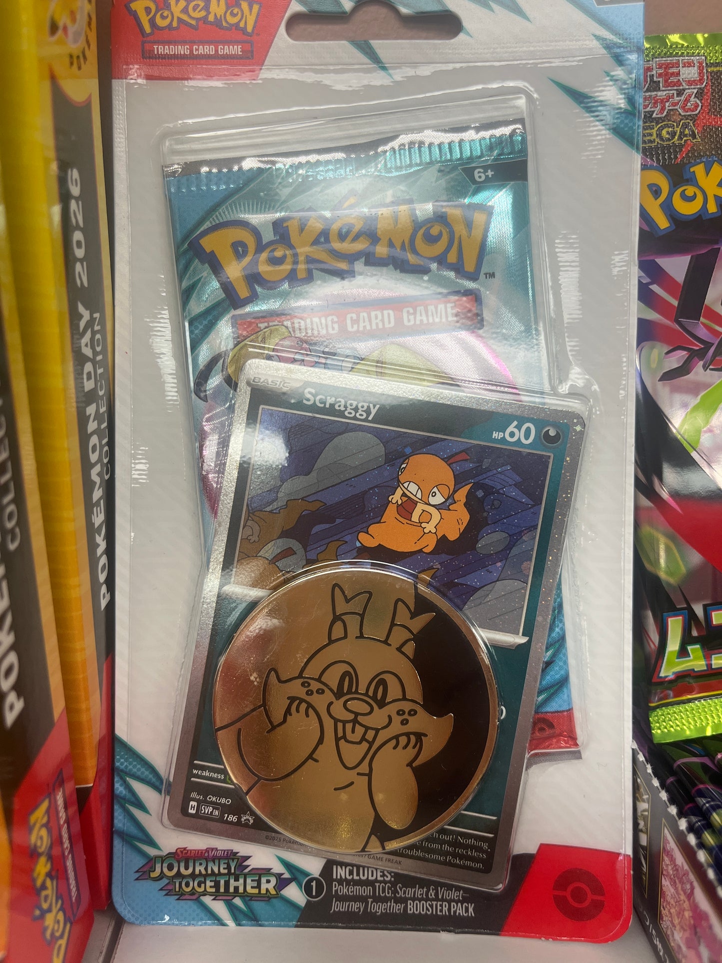 Pokémon Coin and booster pack